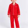 Cheerful Boy in Red Piped Pyjamas Raff & Roo The Christmas Club Pyjamas