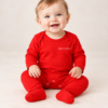 Smiling Baby in Red Rafferty Sleepsuit The Christmas Club Baby Sleepsuit
