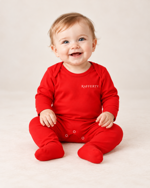 Smiling Baby in Red Rafferty Sleepsuit The Christmas Club Baby Sleepsuit